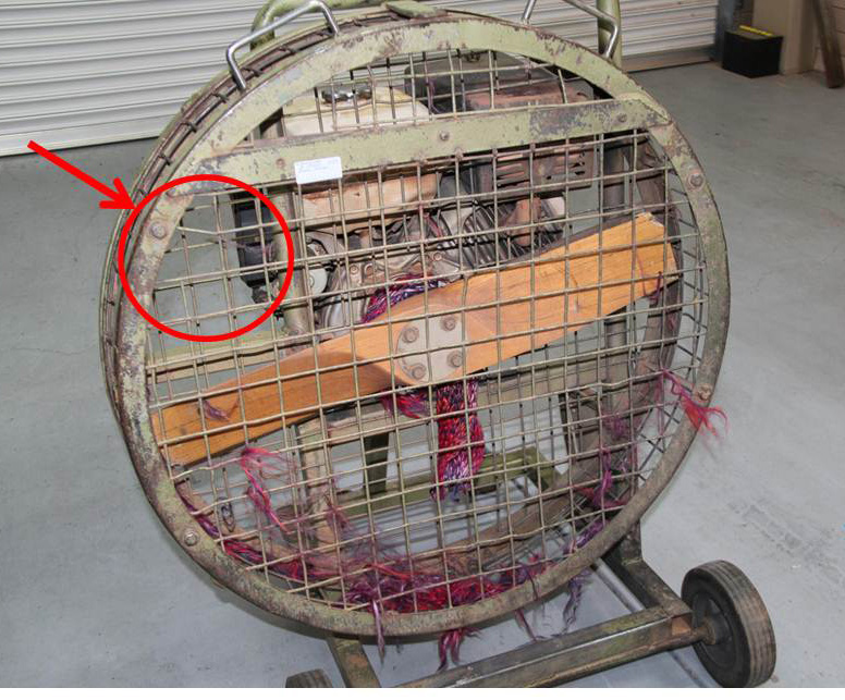 Figure 8: The cold-air inflation fan with remnants of the scarf (pre-existing minor cage damage highlighted)
